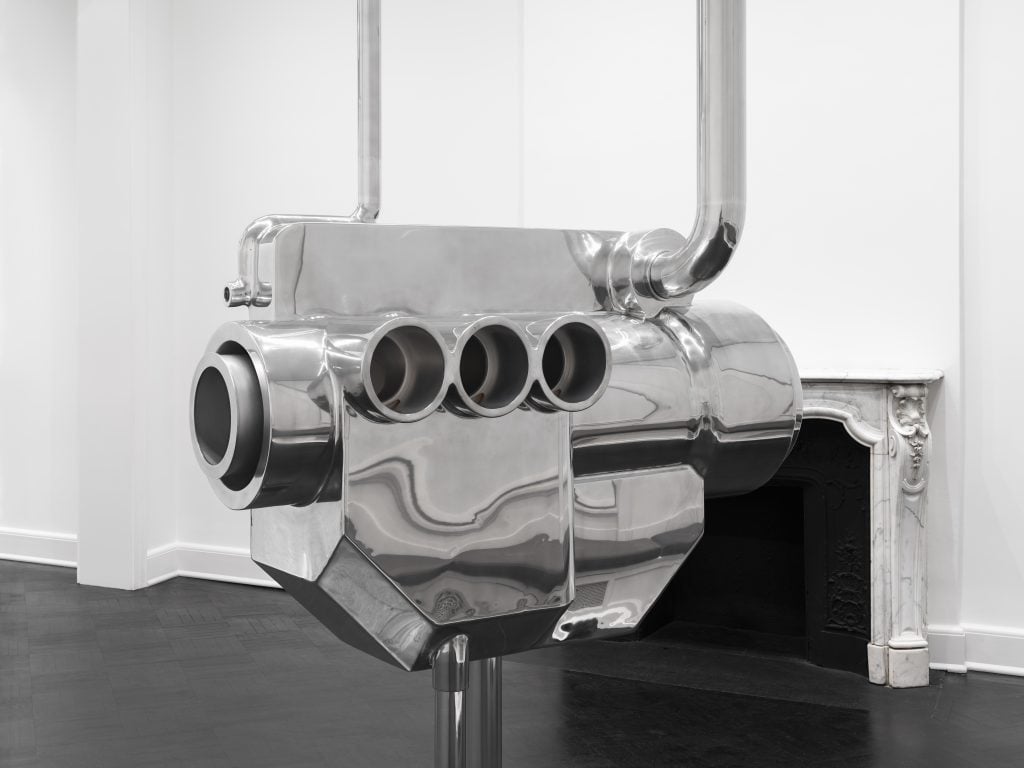 a gleaming sculpture resembles an engine 