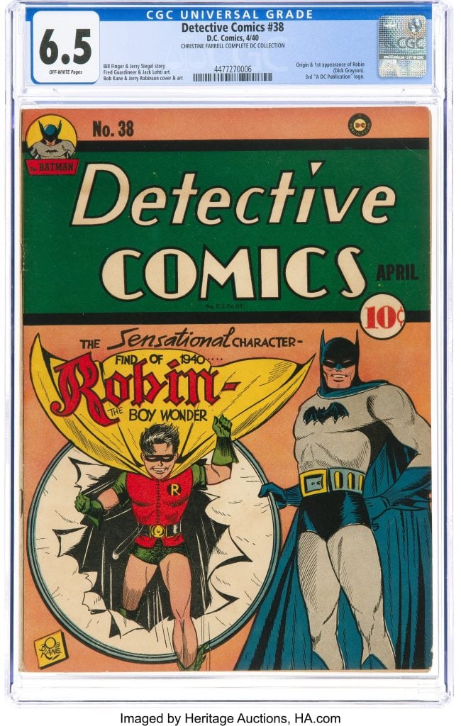 The cover of Detective Comics #38, showing Batman holding a hoop that a young boy Robin is jumping through