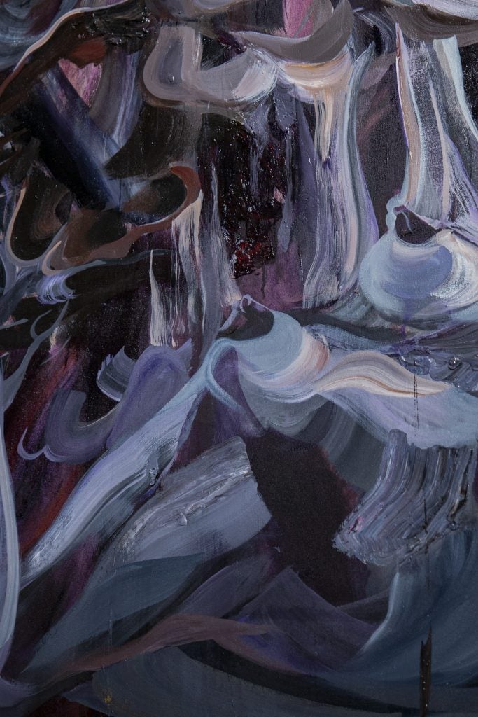 an up close image of a purple blue and red abstract painting