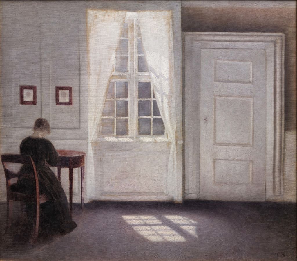 Painting by Vilhelm Hammershoi of a woman in a room, her back to the viewer