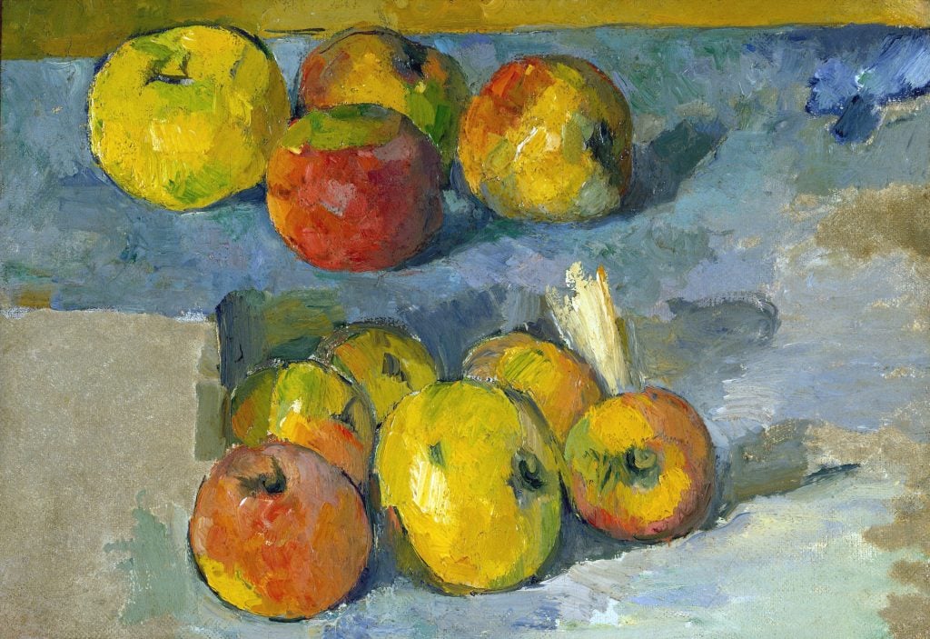 painting of apples on a blue tablecloth