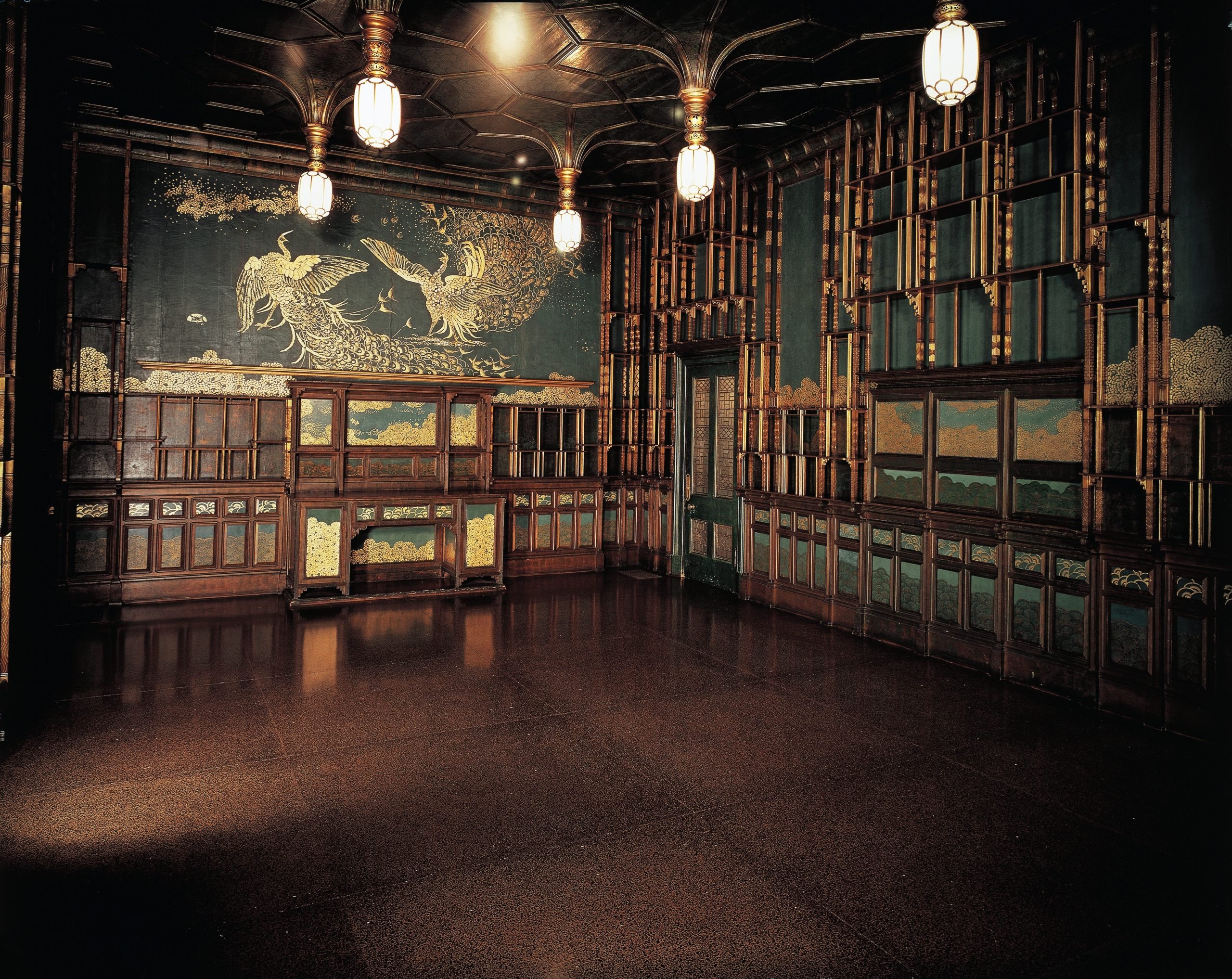 a turquoise and gold interior with wooden carvings