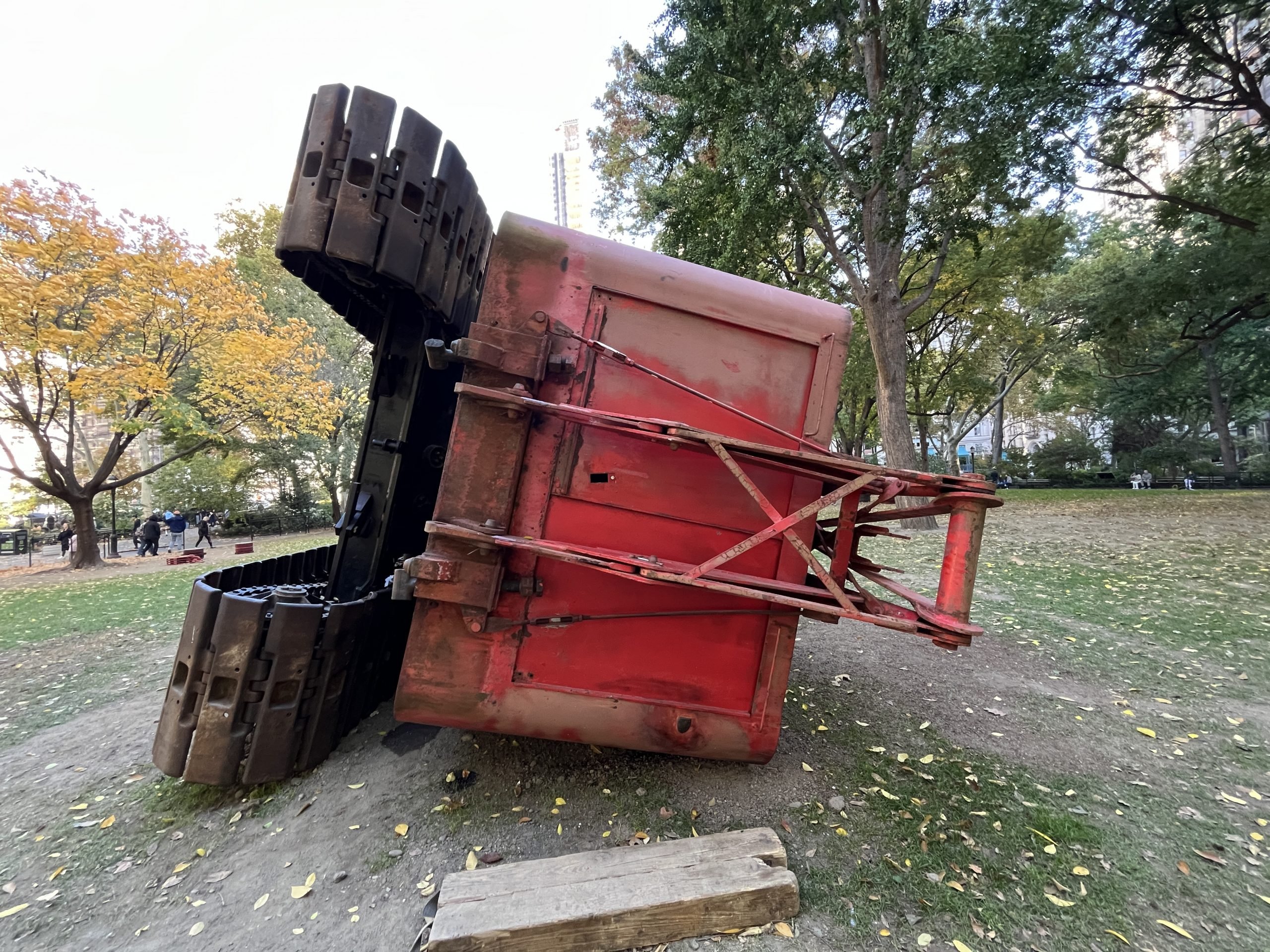 The back of a red crane’s cab is seen head-on.