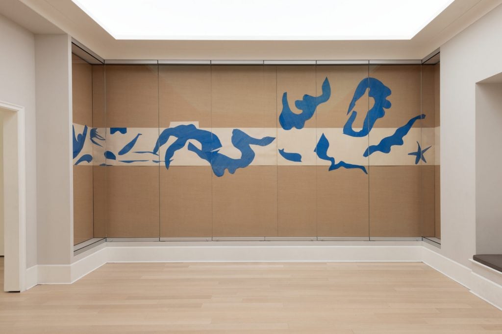 an installation view of Swimming Pool with blue lines on tan background