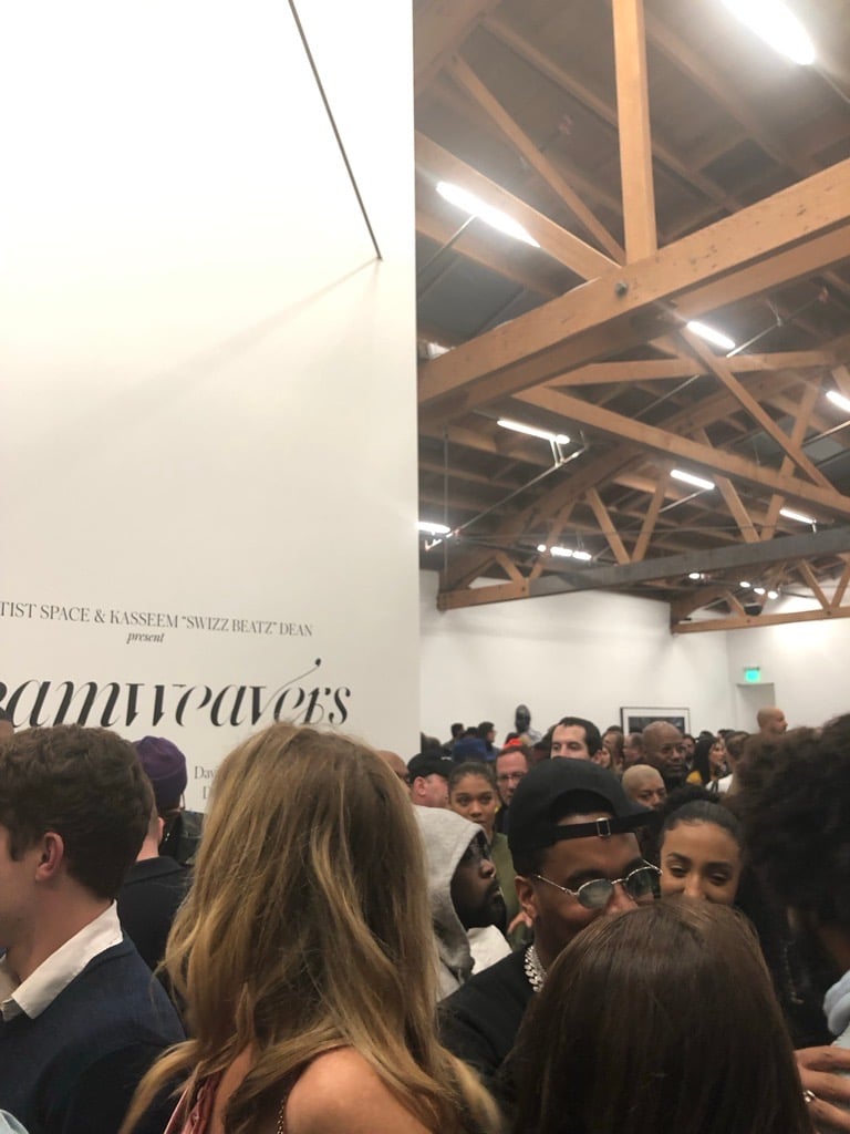 a crowded exhibition opening