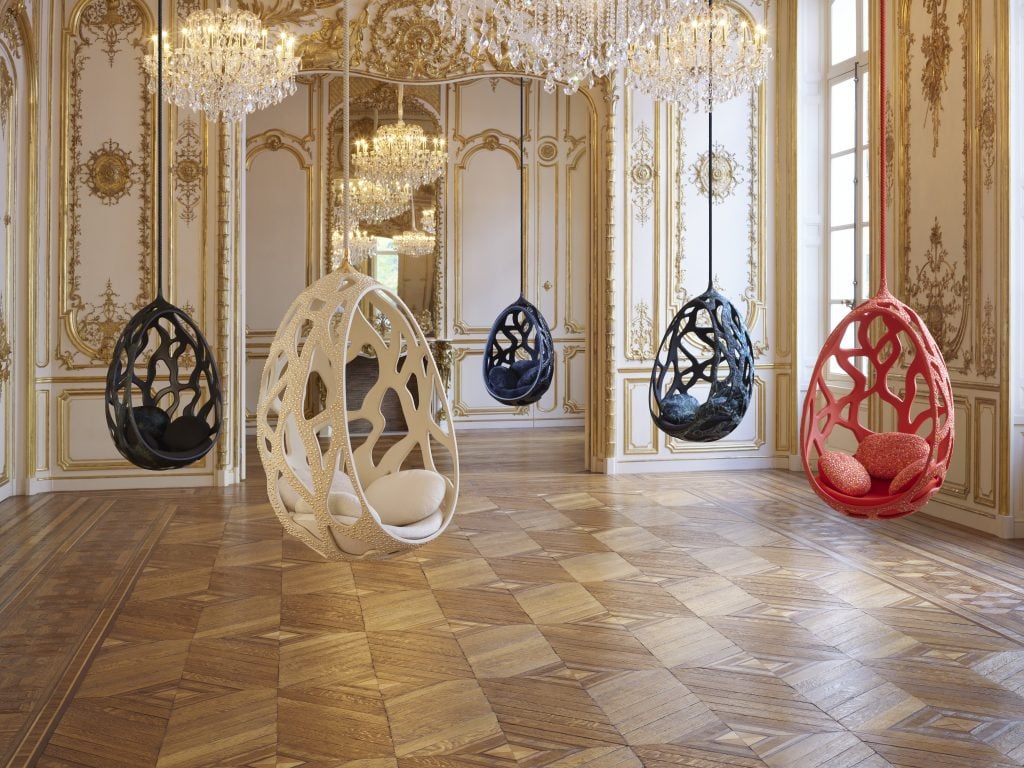 five chairs hang in an opulent European sitting room 