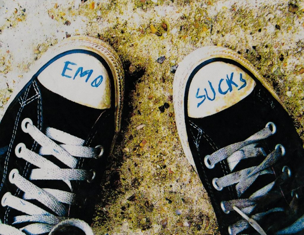 a pair of shows with the word "emo" written on the left and "sucks" written on the right