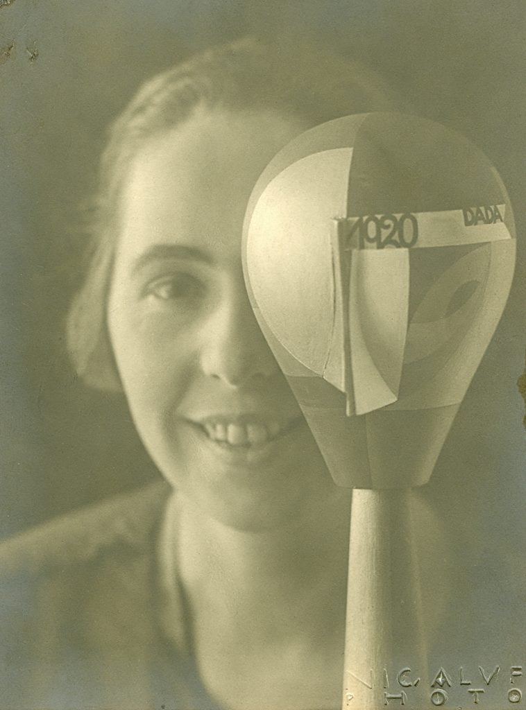 a monochrome self portrait of a woman with a sculpture