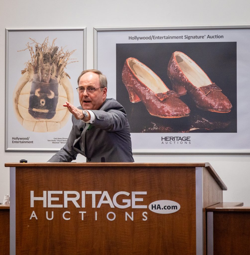 Auctioneer Mike Sadler directing bidding for the ruby slippers. 