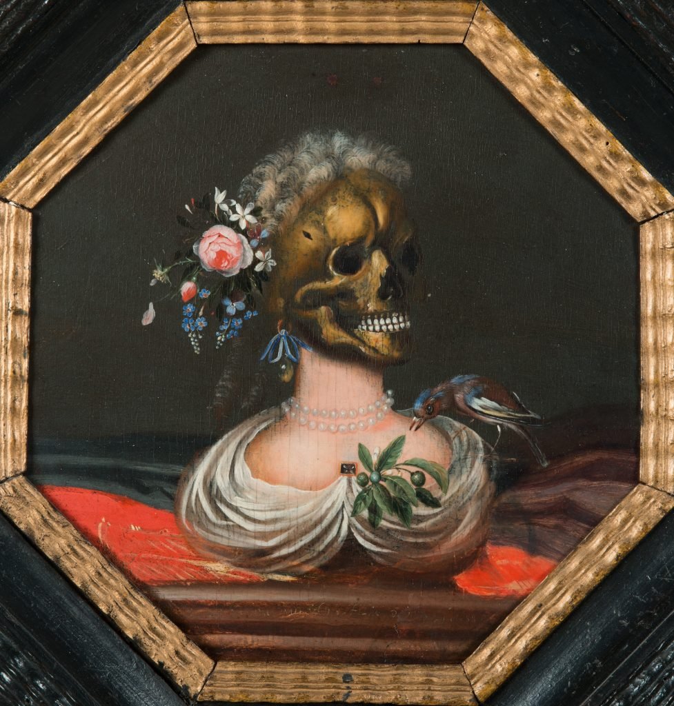 a skull with white hair and flowers