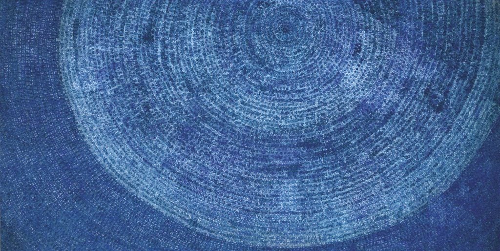 an image of a deep blue, circular dot painting