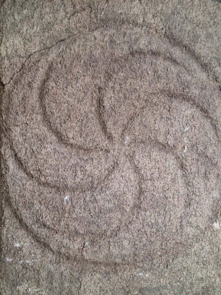 A stone slab carved with an elaborate circular design