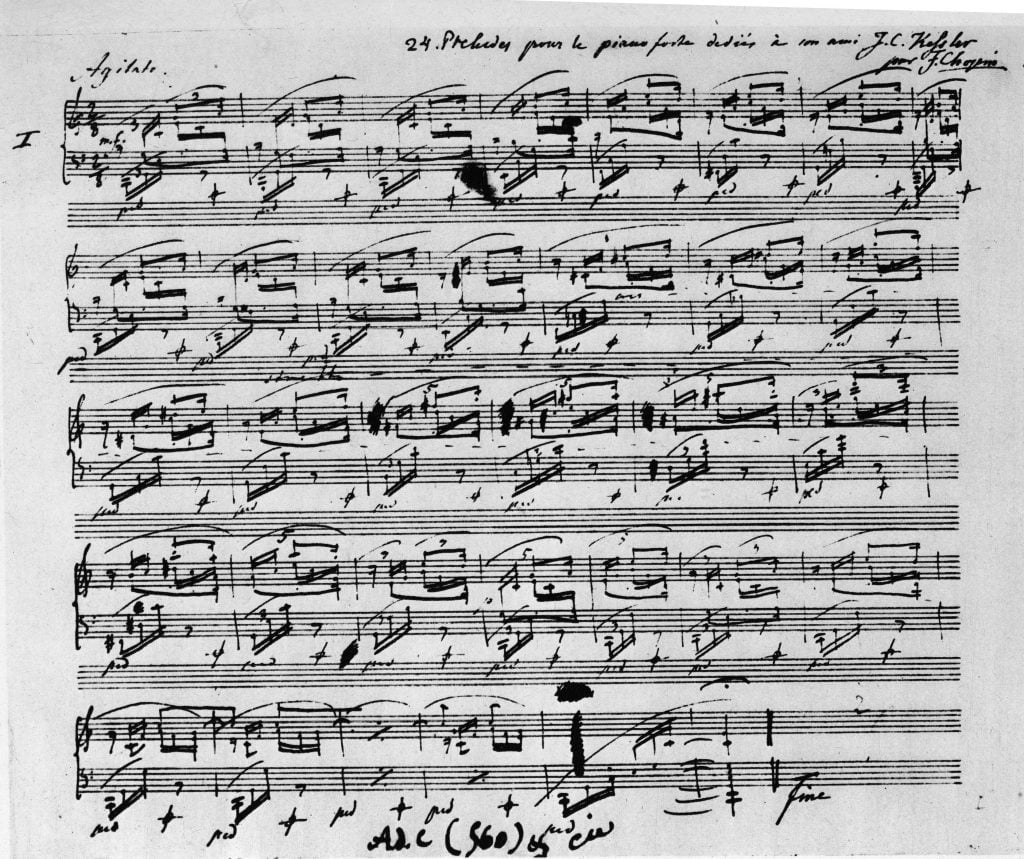 A handwritten musical manuscript of Chopin's Prelude in C Major.