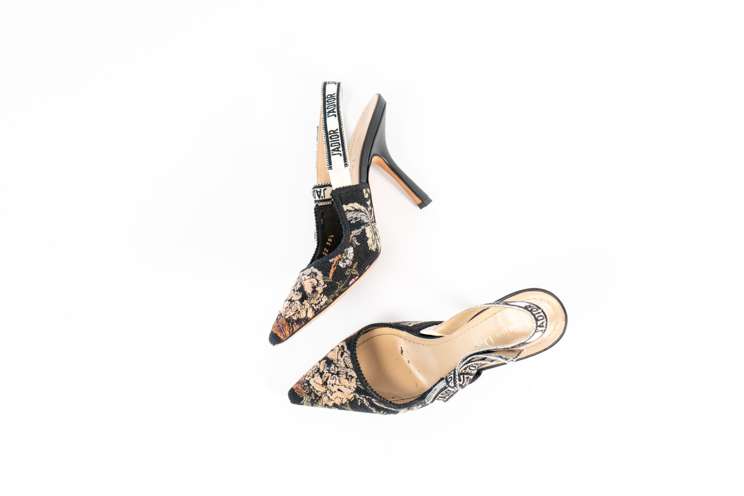 Black flowered brocade Christian Dior slingback heels with pointy toes. 