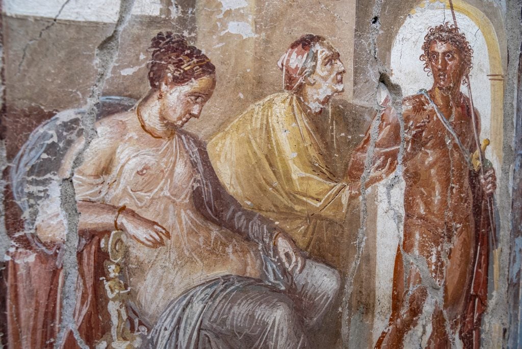 A fresco featuring three figures found in the House of Phaedra in Pompeii.