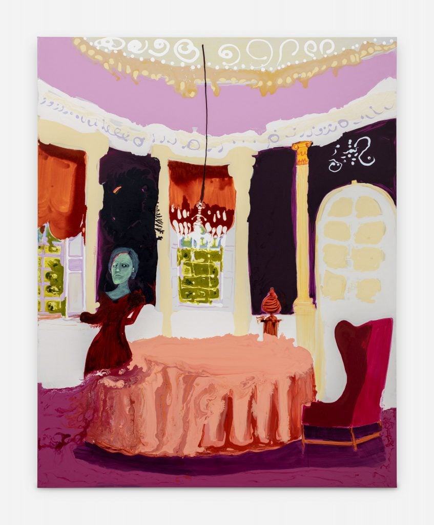 Painting of a historic interior with a central roundish table with a salmon colored tablecloth and a candle chandelier hanging from the ceiling, and a woman with green skin standing at a curtained window looking out, by Irish artist Genieve Figgis.