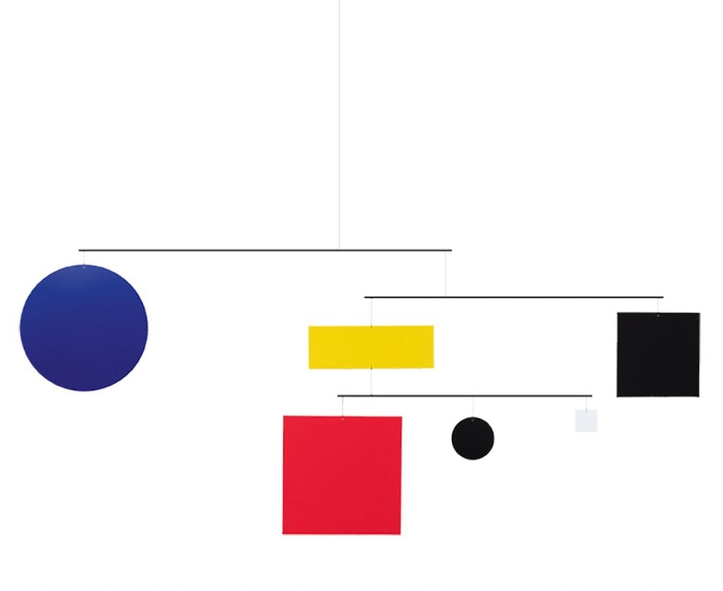 A mobile hung with rectangle and circles colored in primary colors