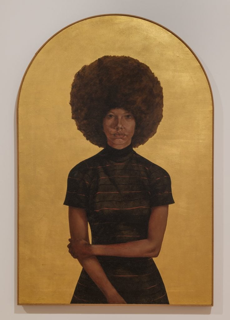 A painting of a Black woman with a large Afro against a gold background