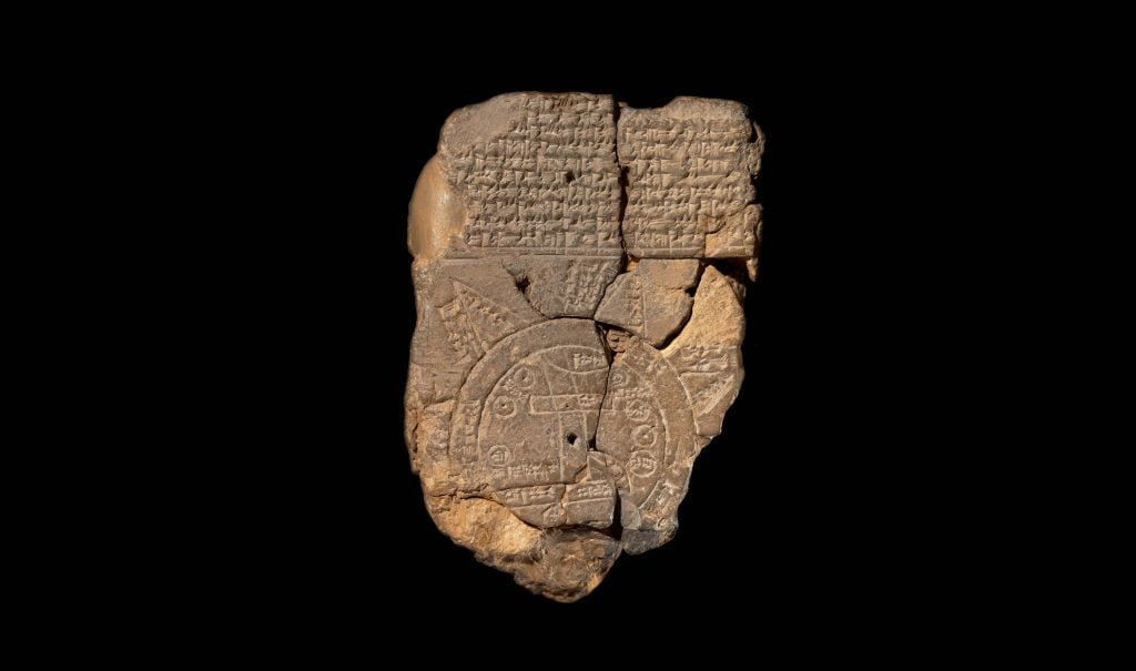 The Imago Mundi clay tablet against a black background.