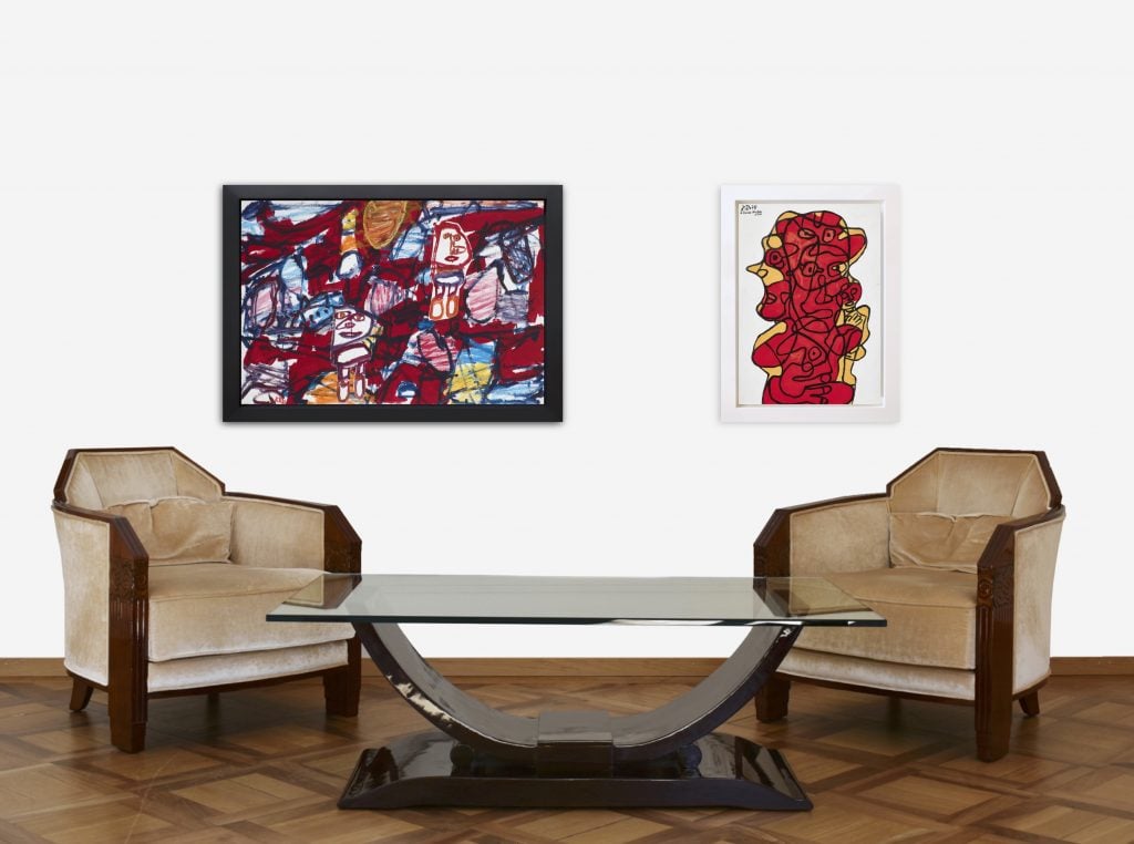 Two works by Jean Dubuffet installed behind a pair of armchairs and coffee table as part of the exhibition Architects of Anarchy.