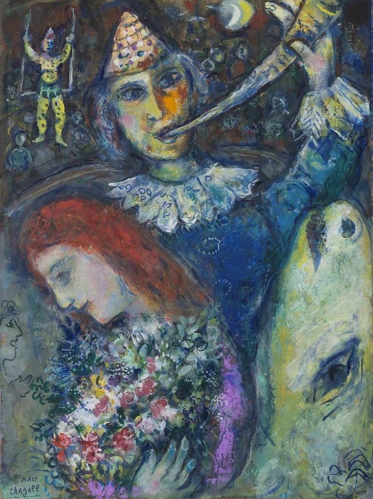 A painting by modern icon artist marc chagall of a clown with a horn behind a woman with red hair with her head bent and the head of a heifer along the right side, and in the distance another clown.