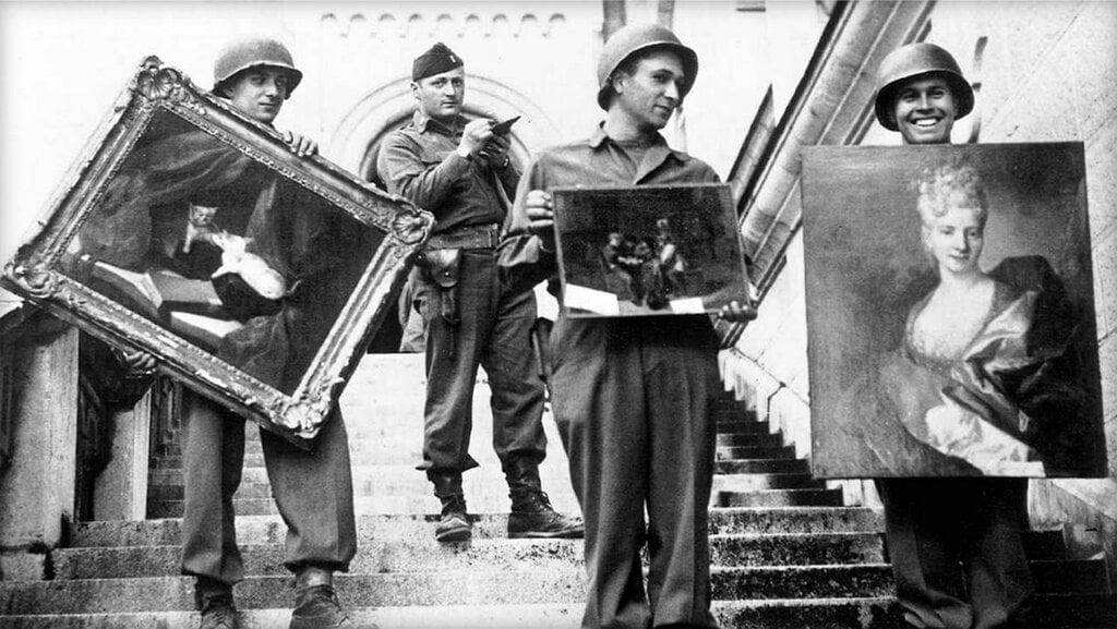 A black and white photo of Monuments, Fine Arts, and Archives (MFAA) Officer James Rorimer supervising U.S. soldiers recovering looted paintings from Neuschwanstein Castle in Germany at the end of World War II. The portrait of the woman, by Nicolas de Largillièrre, is now being sold by Christie's.