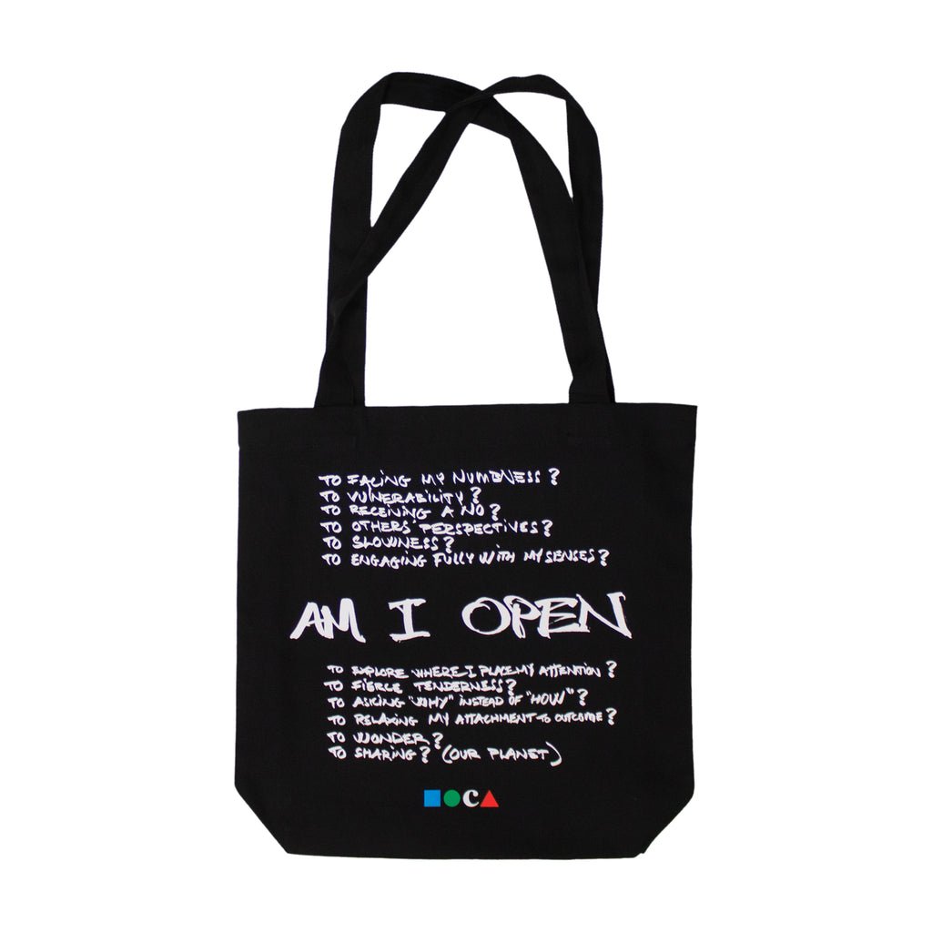 A black tote back with white handwriting and the title "AM I OPEN"