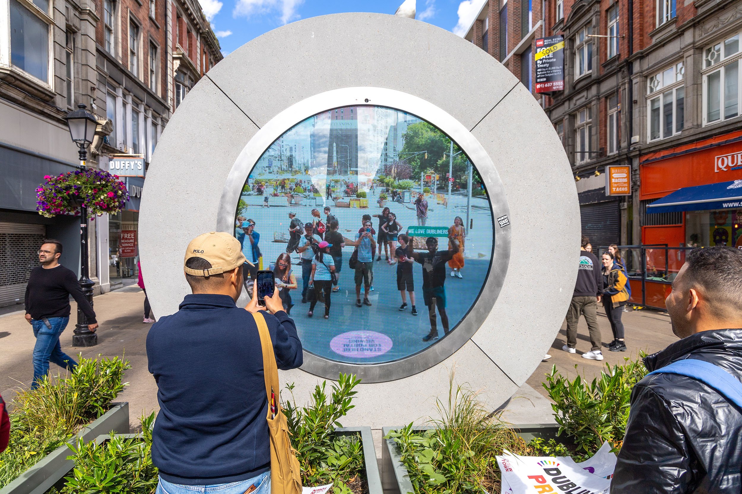 a man takes a picture in front of a portal