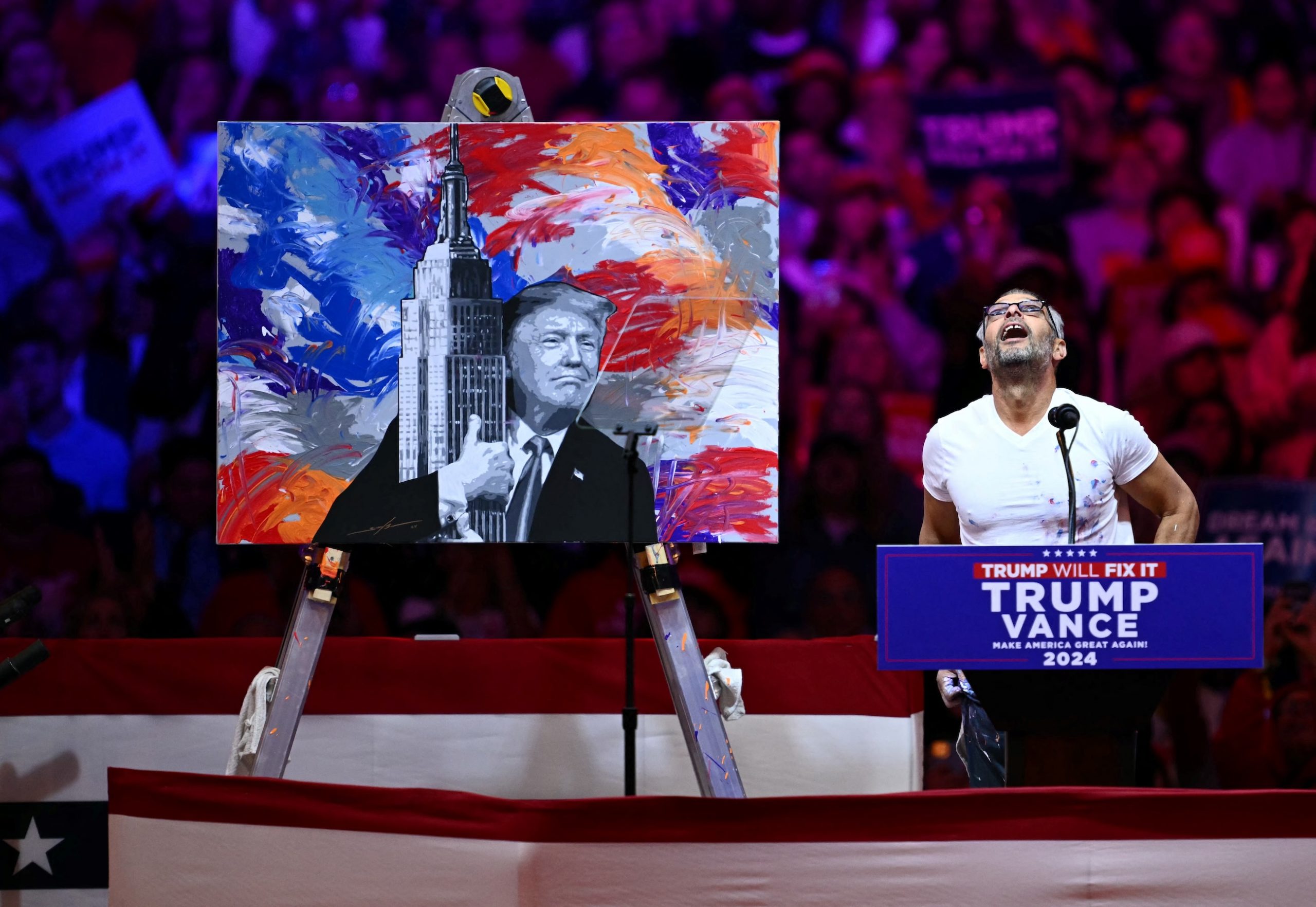 At Donald Trump's Madison Square Garden rally, an artist shows a painting of him hugging the Empire State Building