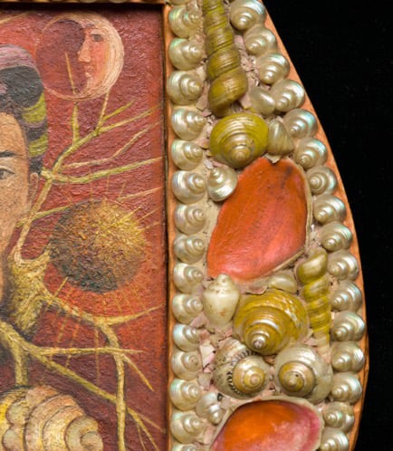 Close-up of the frame of Kahlo's Diego and Frida 1929–1944 inlaid with pearlescent shells and pink-painted scallop shells