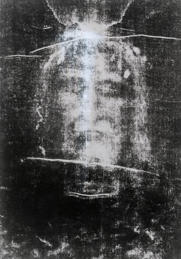 Detail of the Shroud of Turin showing a man's face with his eyes closed