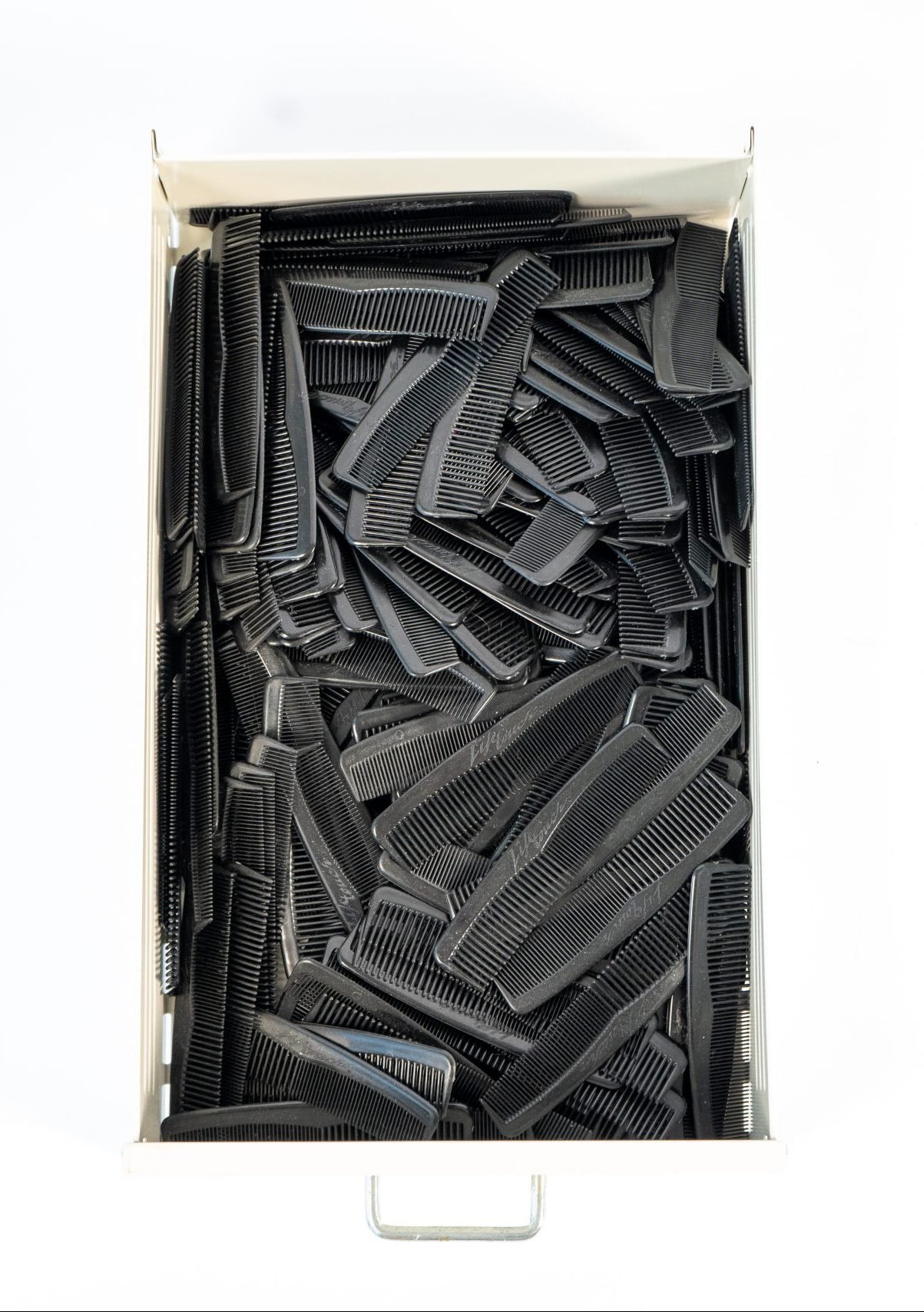 A box of black combs. 