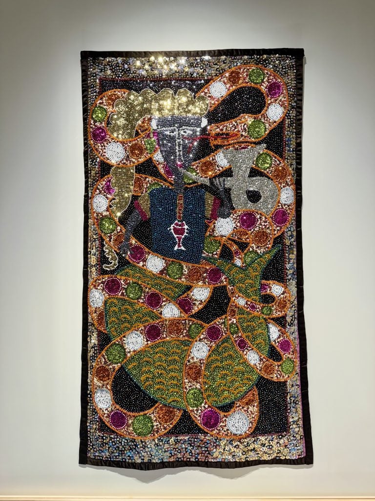 Under a Spell (1992), a sequined work from Tina Girouard's time in Haiti, done with Antoine Oleyant andon view in "Tina Girouard: Sign In" at the Center for Art Research and Alliances, New York. 