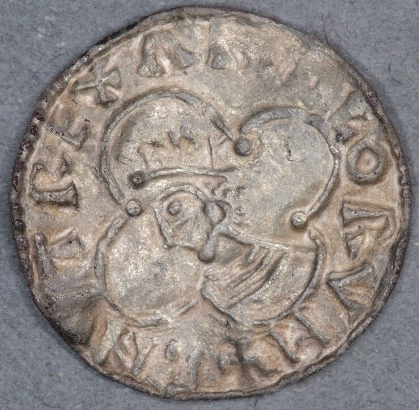 An ancient Viking coin etched with the profile of a king