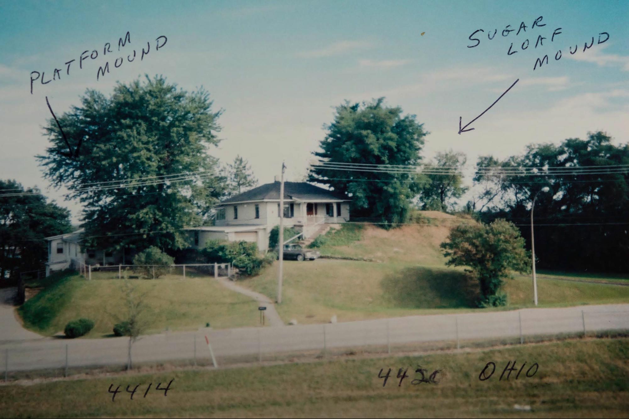 A photograph of a home on a small hill with text noting the locations of Platform Mound and Sugarloaf Mound