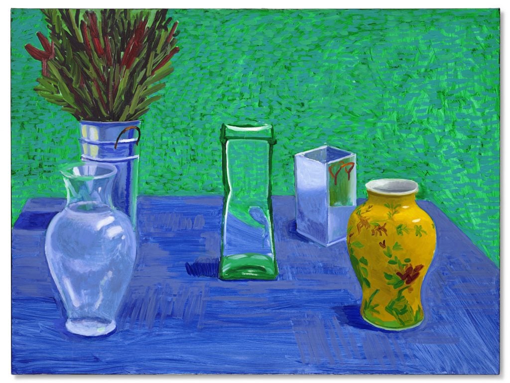 an image vases on a blue table