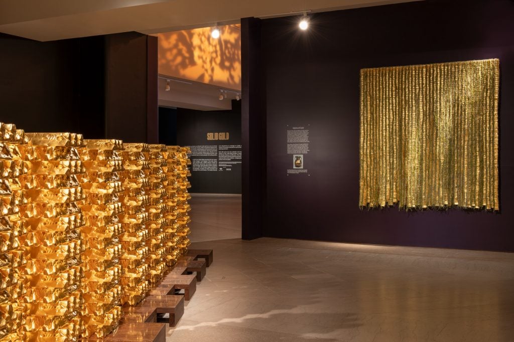 very shiny objects are in a museum display about gold 