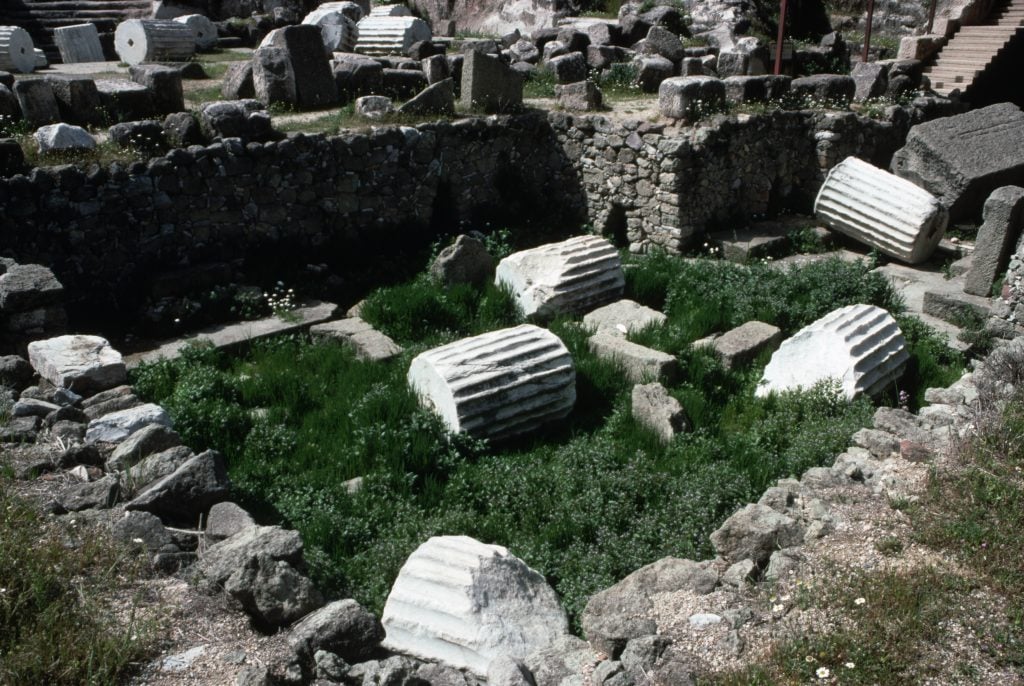 Ruins of white marble columns lay in the grass amid the stone foudnation of what once was the base of Halicarnassus