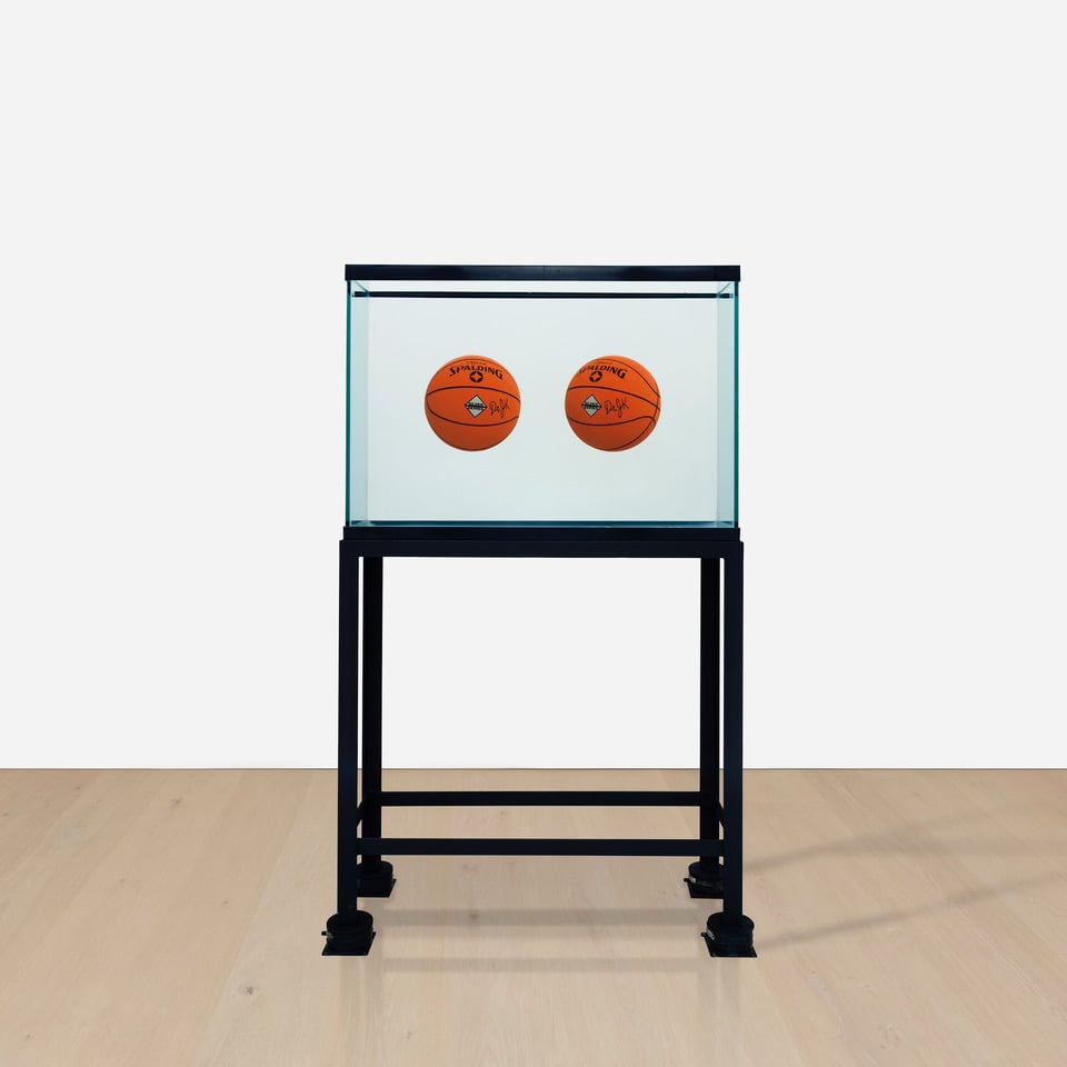 Jeff Koons work with two basketballs floating in a tank as a part of Phillips fall auctions