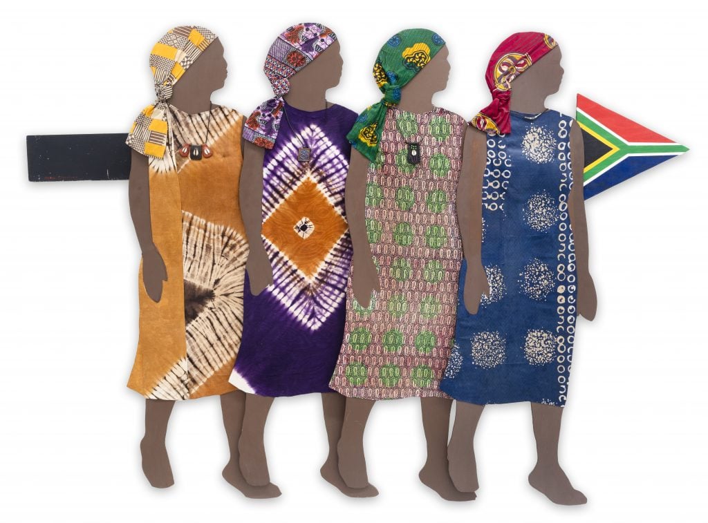 an artwork deictics four African women in colorful native garb standing in front of an arrow 