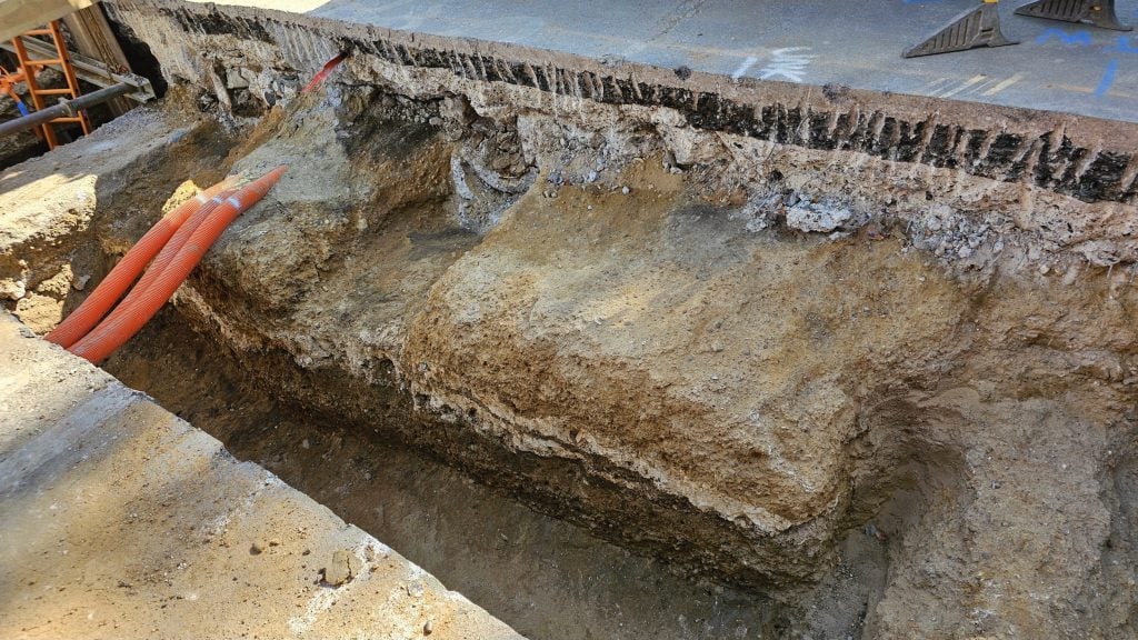 The remains of an ancient Roman-era road are revealed under a modern London street