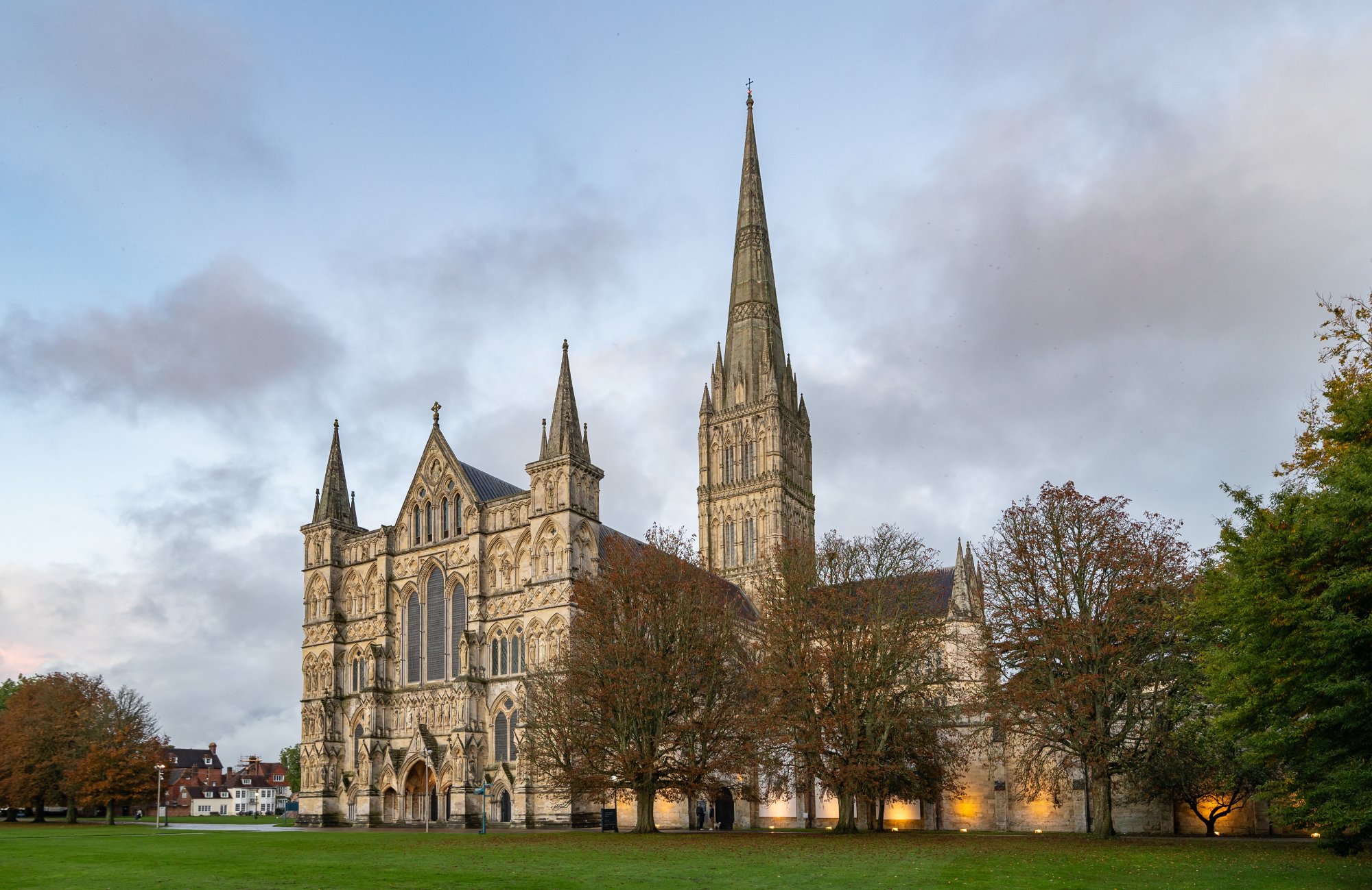 a large and stately Gothic cathedral raising up like a landmark against an evening sky.