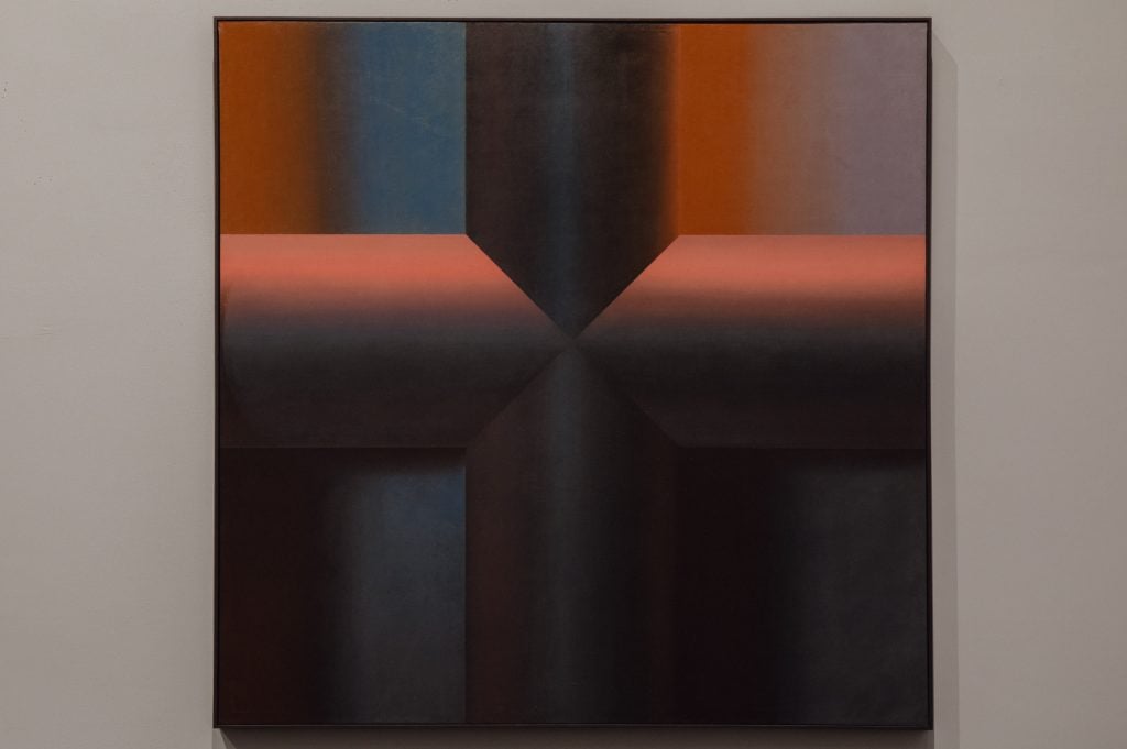 an abstract painting with a cross form in the middle in shades of brown, blue and red