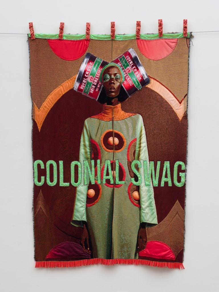 A colorful textile artwork shows a Black woman with the words "swag" that will be on view at Art Basel Miami Beach