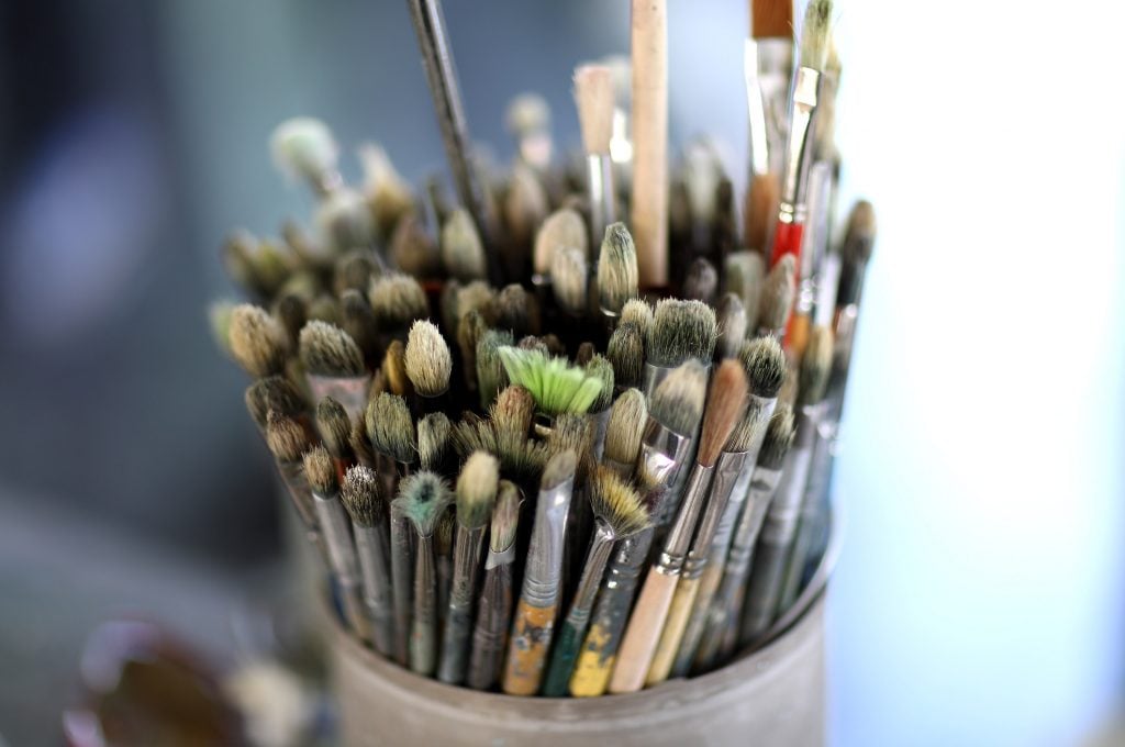 An artist's paintbrushes in his London studio.