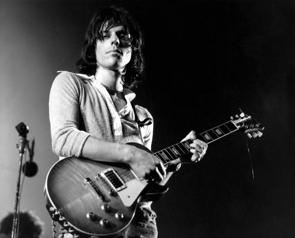 black and white photo of Jeff Beck on stage