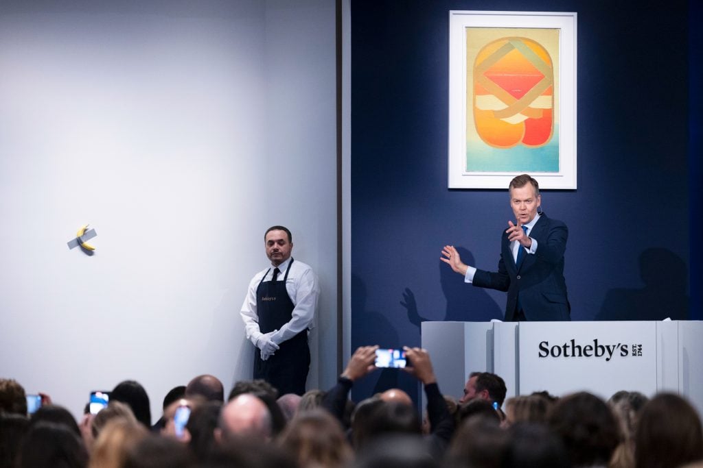 Sotheby's auctioneer Oliver Barker overseeing the bidding for Maurizio Cattelan, Comedian (2019) at Sotheby's on November 20, 2024.