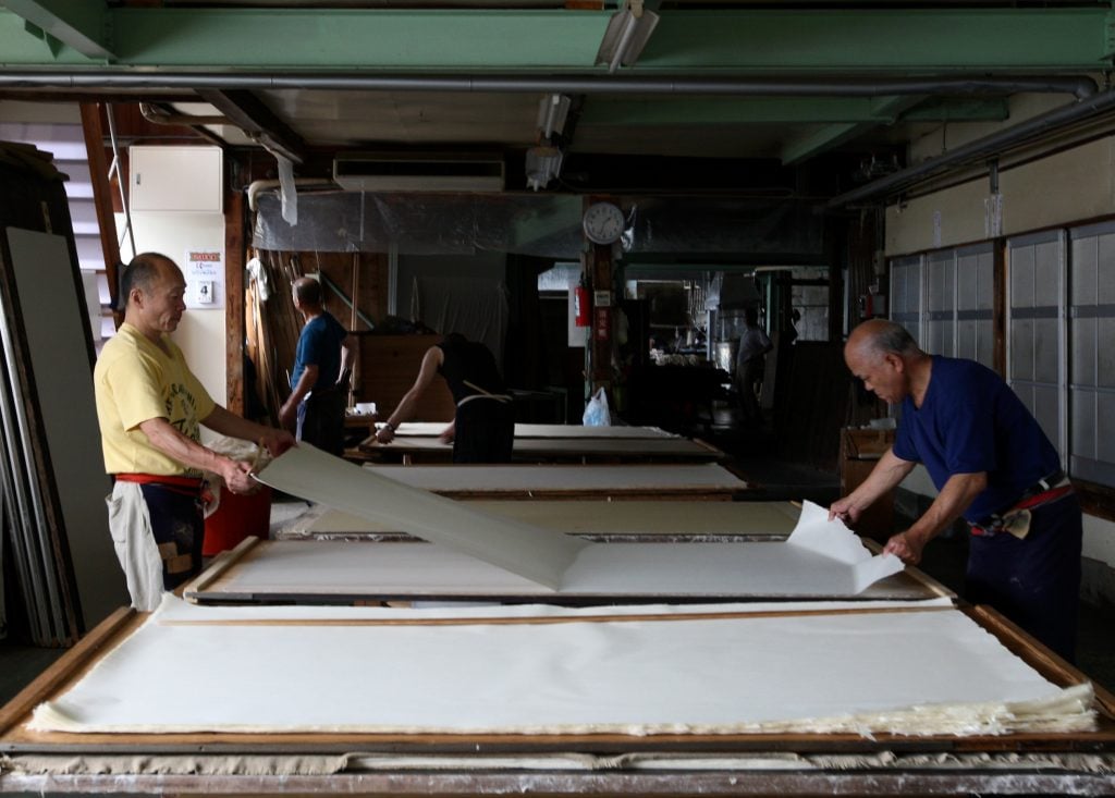 Men at work in a paper mill