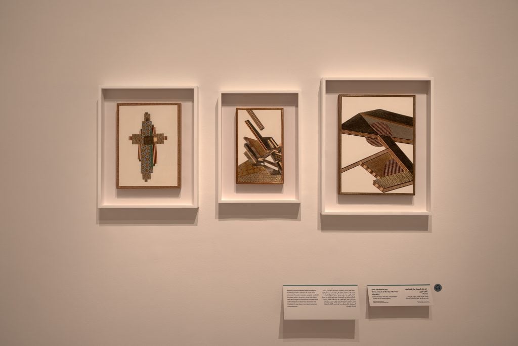 Three works by Farhad Ahrania that are geomatric abstractions done in a style of Persian marquetry, exemplifying a type of Soviet Orientalism.