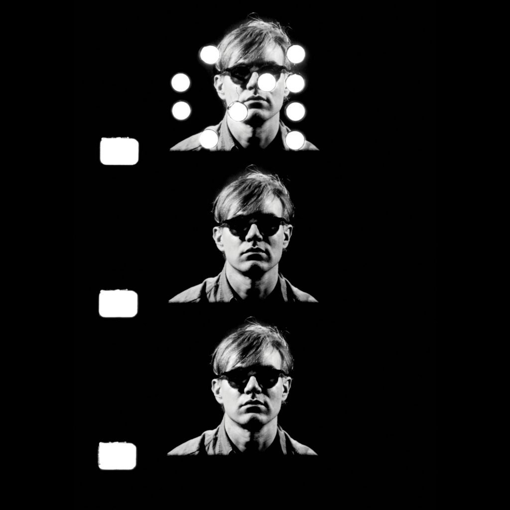 Three film cells showing Andy Warhol in dark sunglasses